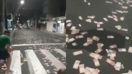 Video: robaron un banco y tiraron billetes a la calle para poder huir